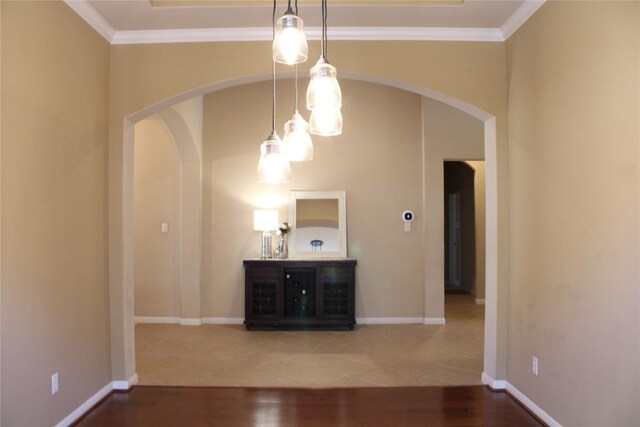 2718 Sun Mountain Dr, Leander, TX 78641 - empty room featuring arched walkways, wood finished floors, and ornamental molding