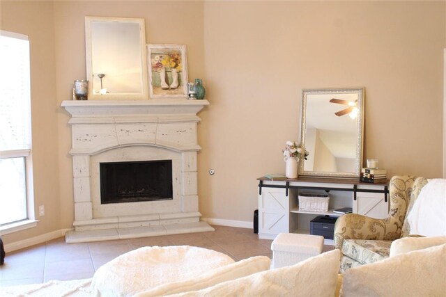2718 Sun Mountain Dr, Leander, TX 78641 - living room featuring tile patterned floors and a fireplace with raised hearth