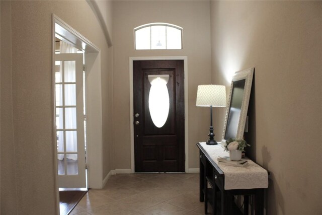 2718 Sun Mountain Dr, Leander, TX 78641 - foyer with light tile patterned floors and a towering ceiling