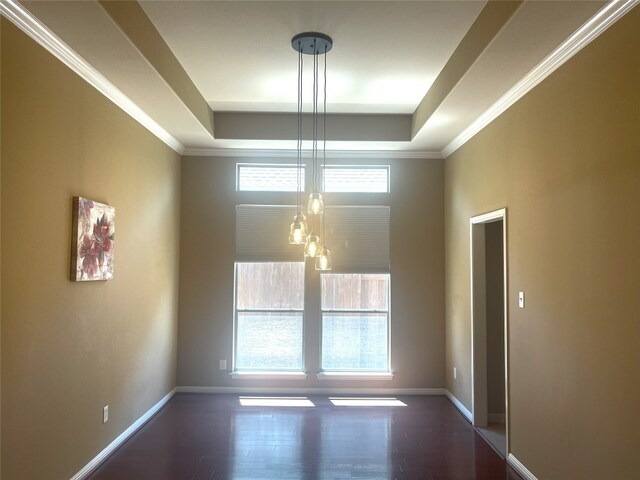 2718 Sun Mountain Dr, Leander, TX 78641 - unfurnished dining area with a raised ceiling, wood finished floors, and crown molding