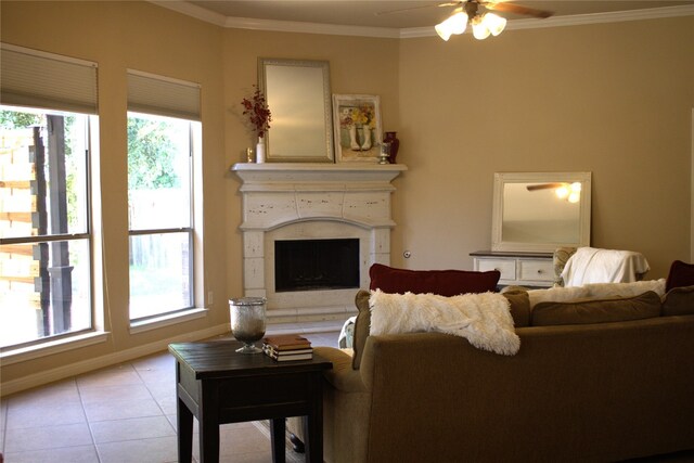 2718 Sun Mountain Dr, Leander, TX 78641 - living room with healthy amount of natural light, a ceiling fan, light tile patterned floors, crown molding, and a fireplace