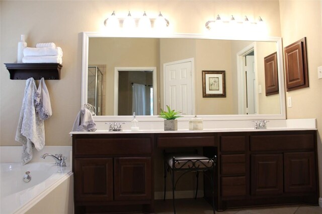 2718 Sun Mountain Dr, Leander, TX 78641 - bathroom featuring double vanity, a bath, and a shower stall