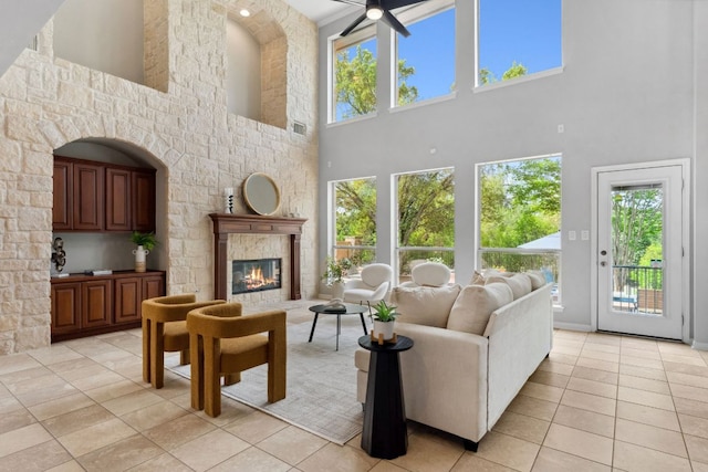 living room featuring a healthy amount of sunlight and a high ceiling