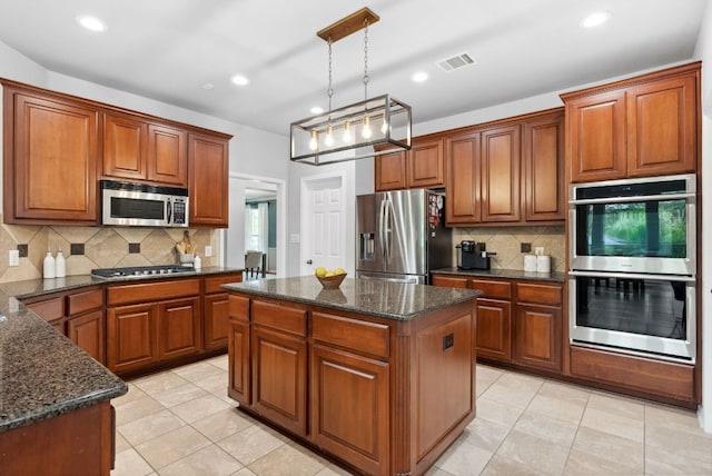10408 Medinah Greens Dr, Austin, TX 78717 - kitchen with appliances with stainless steel finishes, brown cabinets, recessed lighting, and decorative backsplash