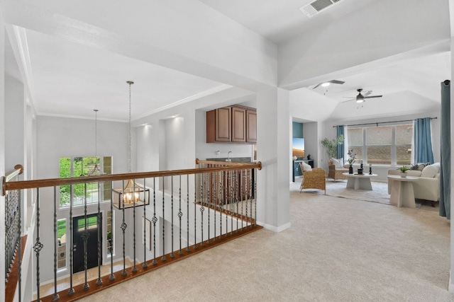 10408 Medinah Greens Dr, Austin, TX 78717 - corridor with carpet, healthy amount of natural light, crown molding, baseboards, and a chandelier