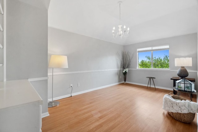 10408 Medinah Greens Dr, Austin, TX 78717 - living area with a chandelier, wood finished floors, baseboards, and vaulted ceiling