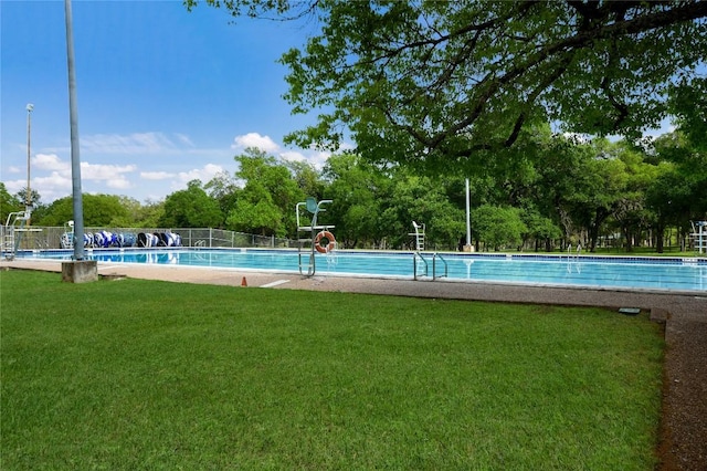 2433 Independence Dr Unit B105, Austin, TX 78745 - community pool with a lawn, fence, and a water slide