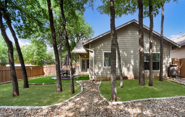 2433 Independence Dr Unit B105, Austin, TX 78745 - view of front of home with a front yard, a patio, and a fenced backyard