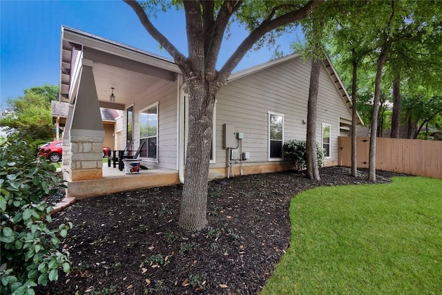 2433 Independence Dr Unit B105, Austin, TX 78745 - back of house featuring fence, a yard, and a porch