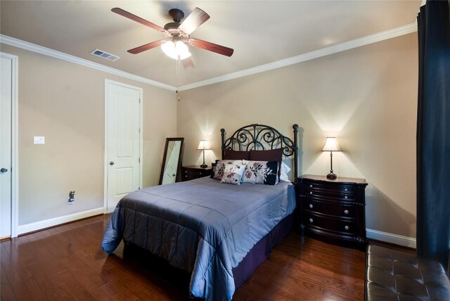 2433 Independence Dr Unit B105, Austin, TX 78745 - bedroom featuring dark wood-style floors, baseboards, visible vents, and crown molding