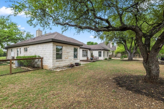 909 Highland Spring Ln, Georgetown, TX 78633 - back of property featuring a chimney and a patio