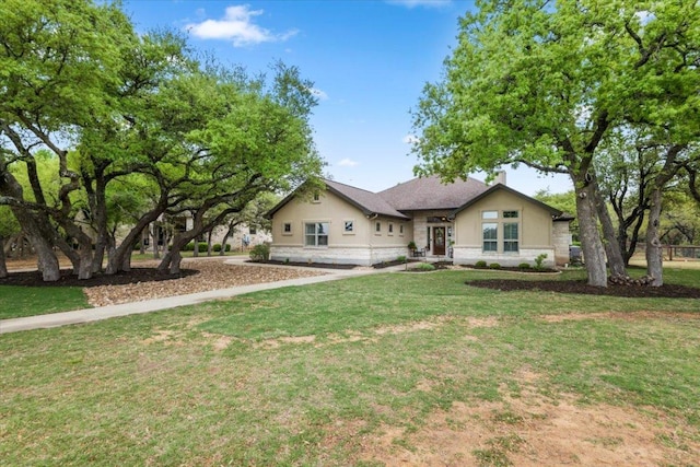 909 Highland Spring Ln, Georgetown, TX 78633 - view of front of house featuring a front lawn and stucco siding