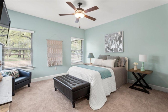 909 Highland Spring Ln, Georgetown, TX 78633 - bedroom with light colored carpet, baseboards, and ceiling fan
