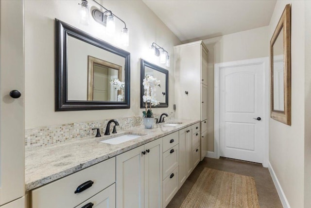 909 Highland Spring Ln, Georgetown, TX 78633 - full bathroom featuring double vanity and baseboards