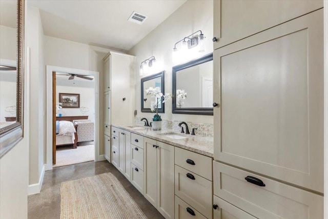909 Highland Spring Ln, Georgetown, TX 78633 - bathroom featuring double vanity, ensuite bath, baseboards, and ceiling fan