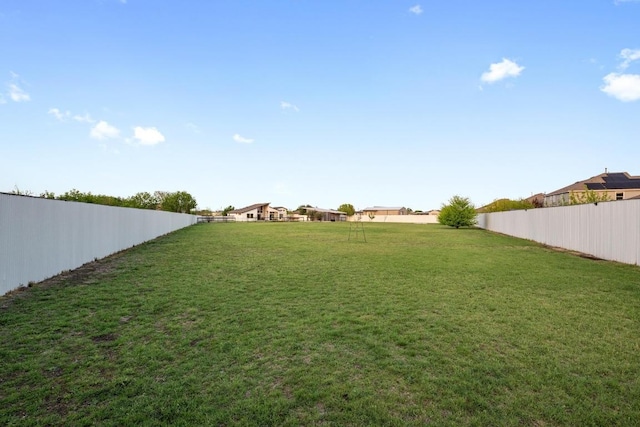 view of yard with a fenced backyard