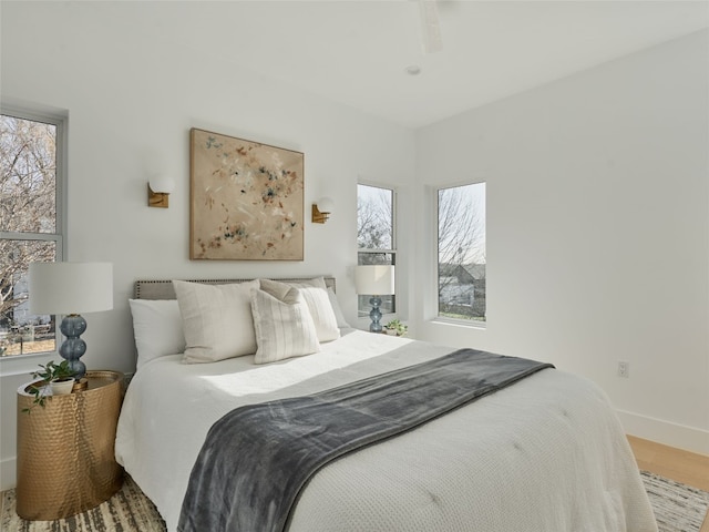 411 Krebs, Austin, TX 78704 - bedroom featuring baseboards and wood finished floors
