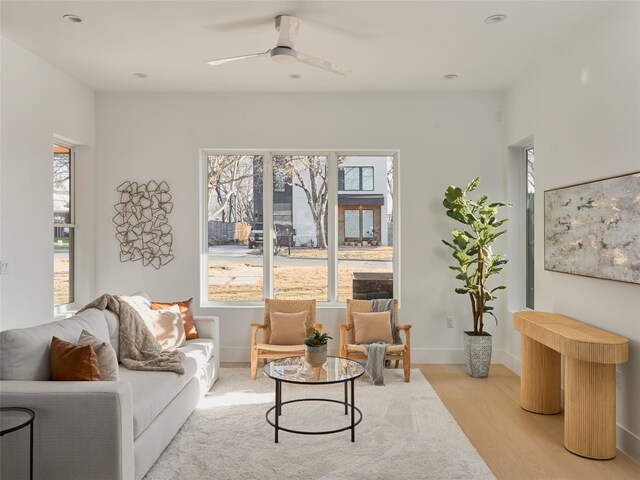 411 Krebs, Austin, TX 78704 - living area featuring ceiling fan, light wood-style floors, and baseboards