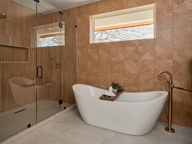 411 Krebs, Austin, TX 78704 - full bathroom with a stall shower, a freestanding bath, and tile patterned flooring