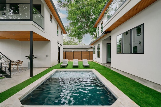 411 Krebs, Austin, TX 78704 - rear view of property featuring stucco siding and a patio