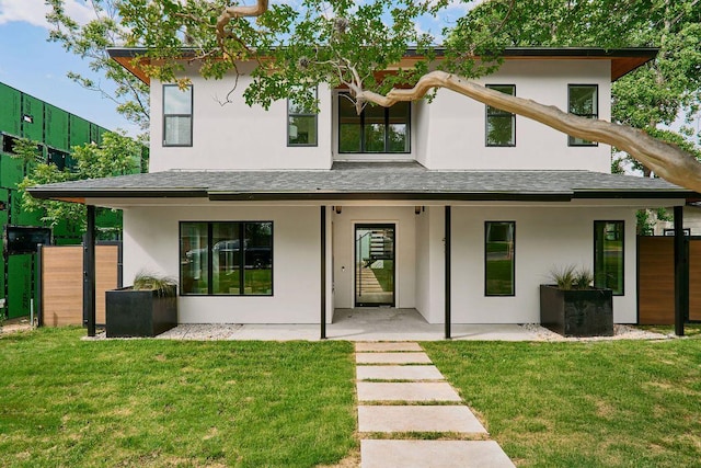 411 Krebs, Austin, TX 78704 - rear view of house featuring stucco siding, a shingled roof, and a patio area