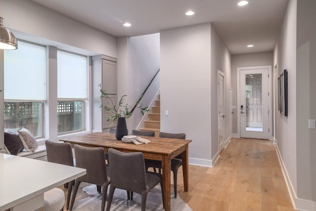 2513 Moreno St, Austin, TX 78723 - dining area featuring light wood-style flooring, recessed lighting, stairway, and baseboards