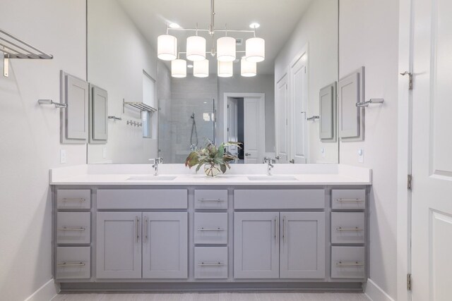 2513 Moreno St, Austin, TX 78723 - bathroom featuring a stall shower, double vanity, baseboards, and a chandelier