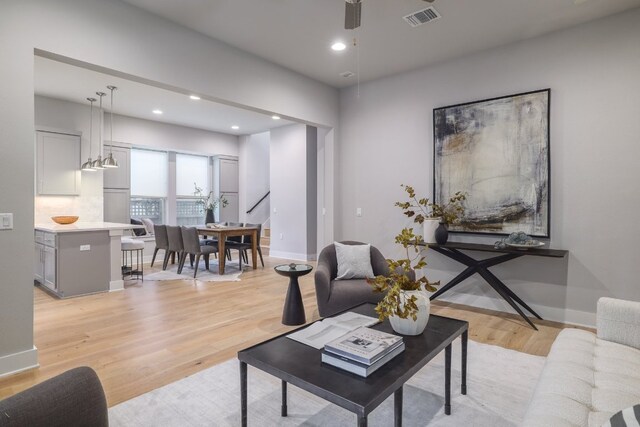 2513 Moreno St, Austin, TX 78723 - living area featuring light wood-type flooring, ceiling fan, recessed lighting, and baseboards
