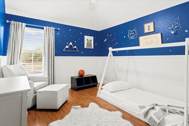 bedroom featuring wood finished floors