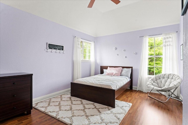 1019 Lone Buck Pass, Cedar Park, TX 78613 - bedroom with wood finished floors, lofted ceiling, and a ceiling fan