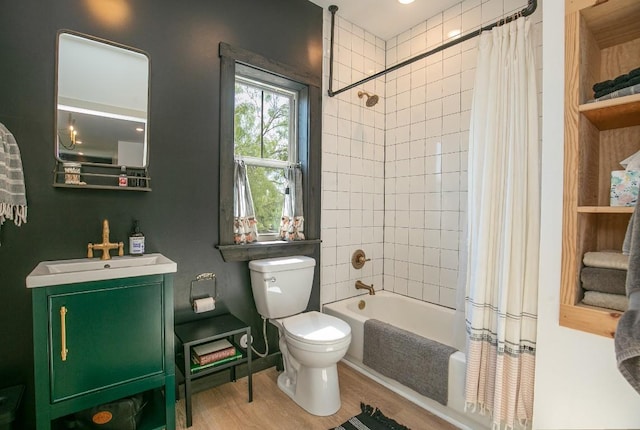 6810 River Oaks Dr, Kingsland, TX 78639 - full bath with wood finished floors, vanity, and shower / tub combo with curtain