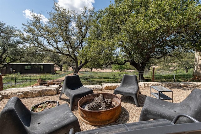 6810 River Oaks Dr, Kingsland, TX 78639 - view of patio / terrace featuring a fire pit
