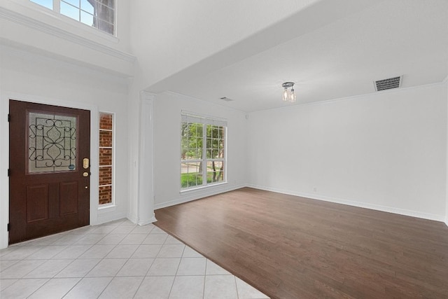 12452 Fairfax Ridge Pl, Austin, TX 78738 - entryway with crown molding, light wood-type flooring, and baseboards