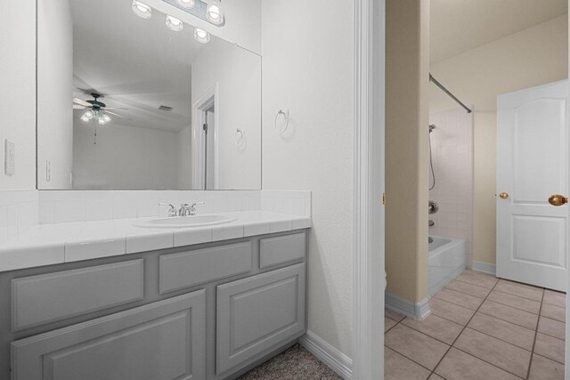 12452 Fairfax Ridge Pl, Austin, TX 78738 - bathroom with ceiling fan, vanity, tile patterned floors, and shower / bathtub combination