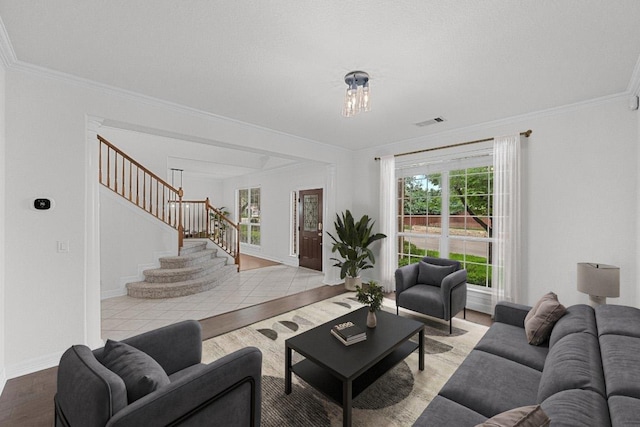 12452 Fairfax Ridge Pl, Austin, TX 78738 - living area with stairs, crown molding, and wood finished floors