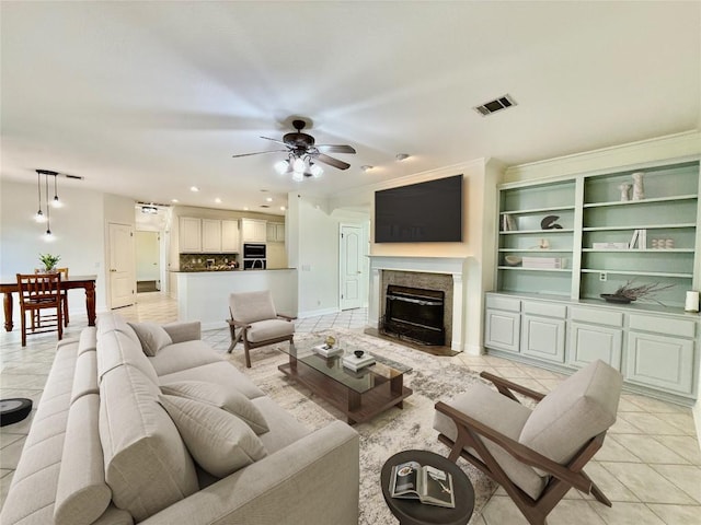 12452 Fairfax Ridge Pl, Austin, TX 78738 - living area featuring light tile patterned floors, ceiling fan, a fireplace with flush hearth, and recessed lighting
