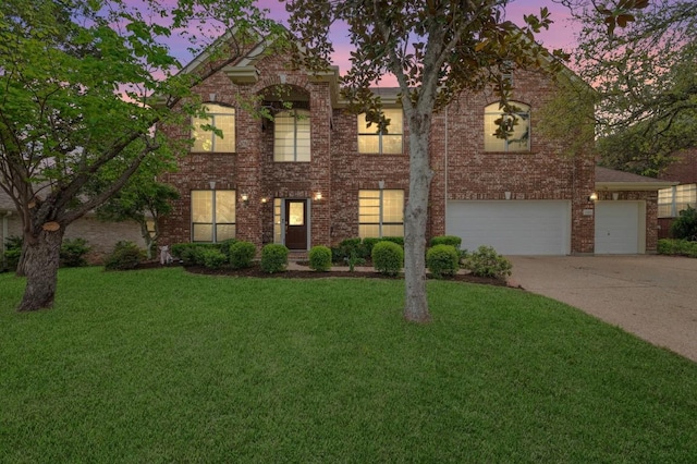 12452 Fairfax Ridge Pl, Austin, TX 78738 - view of front facade with driveway, a yard, brick siding, and a garage