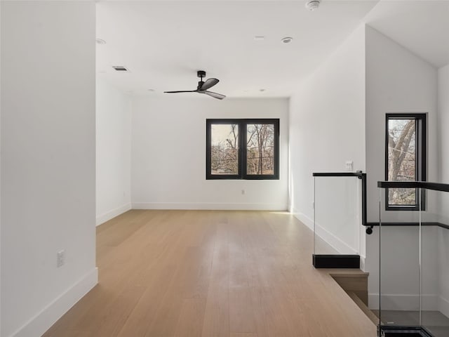 3210 Thompson, Austin, TX 78702 - spare room with plenty of natural light, wood finished floors, and baseboards