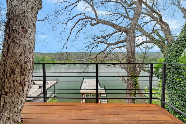 wooden deck featuring a water view