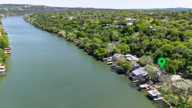 bird's eye view featuring a view of trees and a water view
