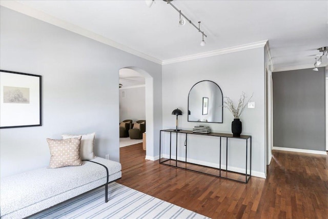 2210 Meadowbrook Dr, Austin, TX 78703 - sitting room with crown molding, arched walkways, track lighting, and wood finished floors