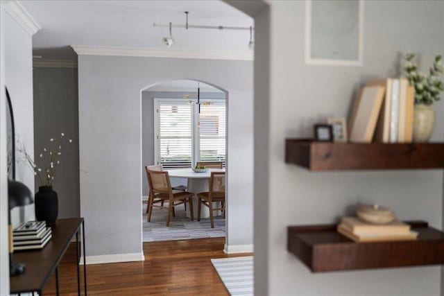 2210 Meadowbrook Dr, Austin, TX 78703 - hall with ornamental molding, arched walkways, and dark wood finished floors