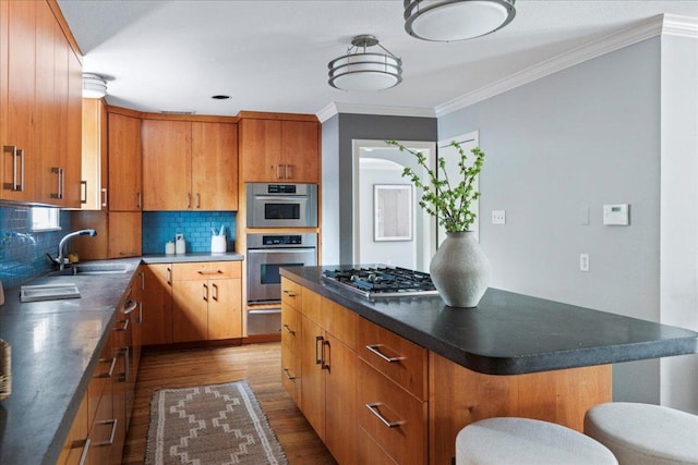 2210 Meadowbrook Dr, Austin, TX 78703 - kitchen featuring stainless steel gas cooktop, wood finished floors, decorative backsplash, a warming drawer, and dark countertops