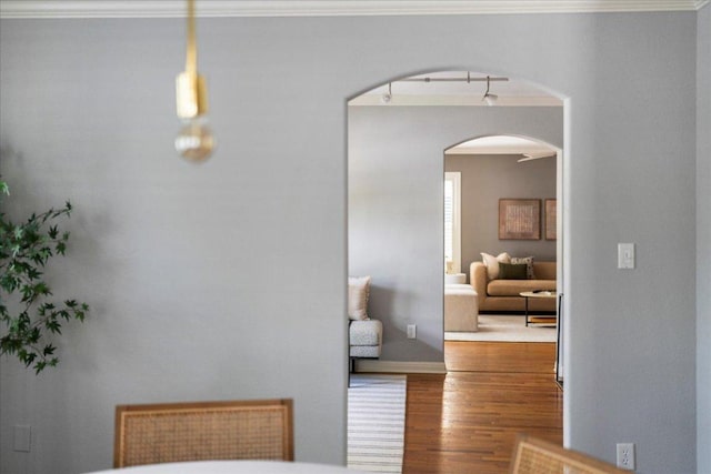2210 Meadowbrook Dr, Austin, TX 78703 - corridor featuring arched walkways, wood finished floors, and ornamental molding