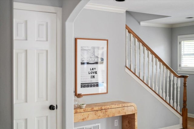 2210 Meadowbrook Dr, Austin, TX 78703 - staircase featuring ornamental molding and arched walkways