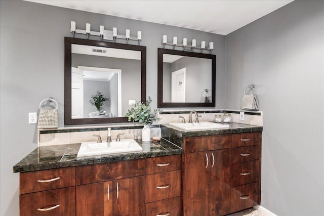 2210 Meadowbrook Dr, Austin, TX 78703 - bathroom featuring double vanity and tasteful backsplash