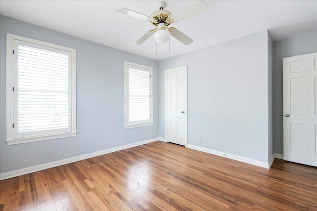 2210 Meadowbrook Dr, Austin, TX 78703 - spare room featuring wood finished floors and a ceiling fan