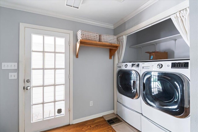 2210 Meadowbrook Dr, Austin, TX 78703 - laundry area featuring ornamental molding and washer and clothes dryer