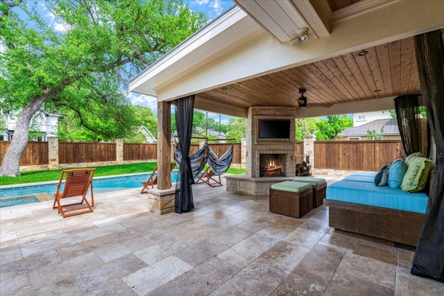 2210 Meadowbrook Dr, Austin, TX 78703 - fenced backyard featuring an outdoor stone fireplace and a patio