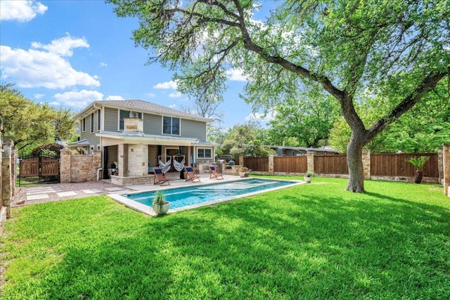 2210 Meadowbrook Dr, Austin, TX 78703 - rear view of house with a fenced backyard, a patio, and stone siding